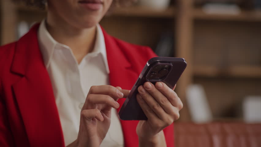 Businesswoman Interacting with Smartphone Screen