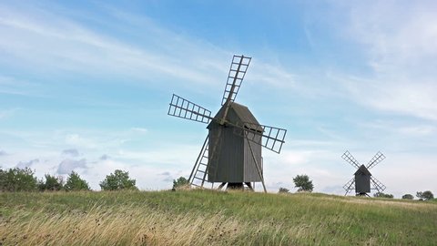 4K Timelapse of Old Wooden Windmills on Beautiful Nature Landscape