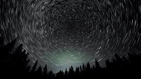Time lapse looking up into the night sky at the north-star. The movement of the stars is highlighted by the use of a star-trails or comet technique.  The motion of the stars around the north-star can  - Powered by Shutterstock - Get 15% off with code: PIKWIZARD15