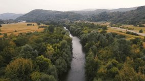 Drone flight above river in South Serbia, bird's view of beautiful nature around river, Srbija