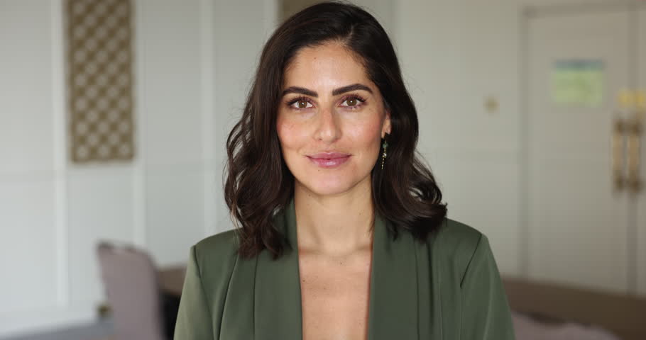 Head shot successful businesslady, corporate staff member. Close up portrait of beautiful Mexican woman, business coach, professional occupation person, sales manager posing indoor looking at camera