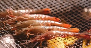 Barbecue with shrimp on metal net