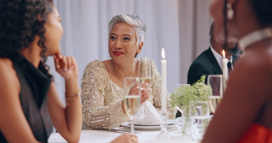 Champagne, dinner party and woman friends toast for social group event, reunion or celebrate New Year. Fine dining, home and classy people cheers with alcohol, drinks or sparkling white wine in glass