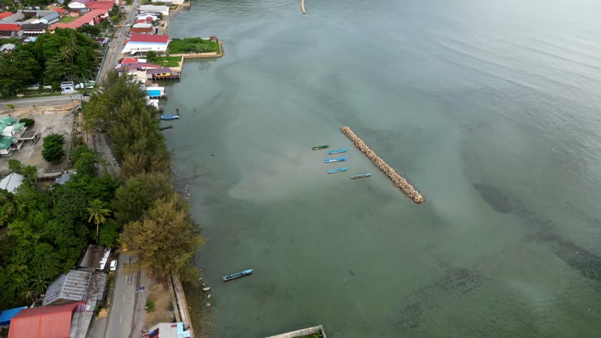 aerial view of wave barrier or breakwater in Kaimana Regency, West Papua