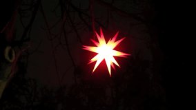 Full HD Video of swaying Christmas star in complex shape, zooming in 