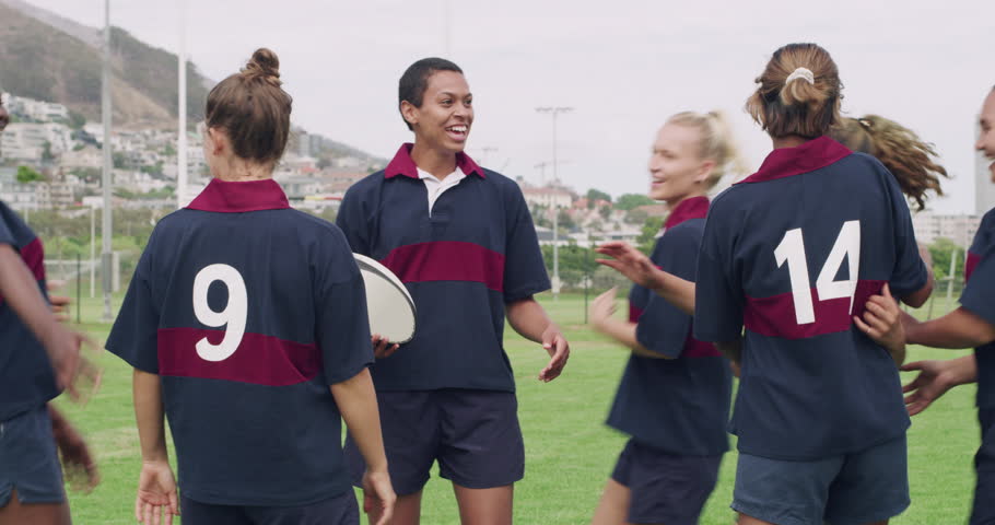 Woman, rugby and team hug in celebration for winning, motivation or sports together on outdoor grass field. Happy female person, friends or group smile for game victory or good match in nature