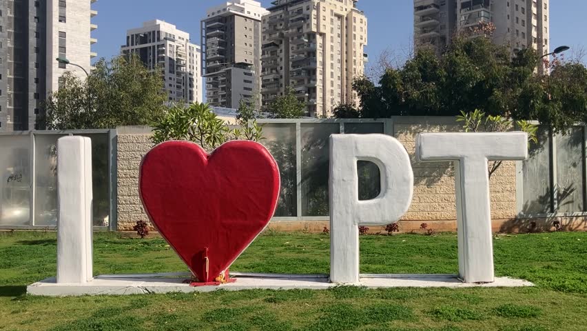 Petah Tikva is a city in Israel. The symbol of the city against the backdrop of a new residential area. I love Petah Tikva