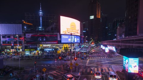 KUALA LUMPUR, MALAYSIA, DECEMBER 02 2017 : 4k ProRes time lapse of transportation rush at night through the Bukit Bintang intersection in the Kuala Lumpur City Centre.