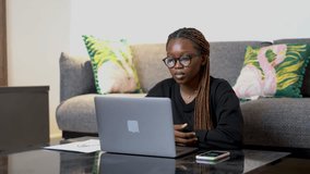 Black woman making a presentation on her laptop
