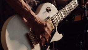 Musician plays an electric guitar. Guitar players hands close-up. Rock singer plays music at concert. - Powered by Shutterstock - Get 15% off with code: PIKWIZARD15