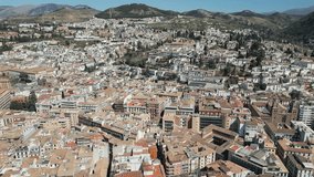 Panorama of Granada, nestled in the heart of Andalusia, Spain, is a captivating city steeped in history and adorned with architectural treasures. Aerial video.