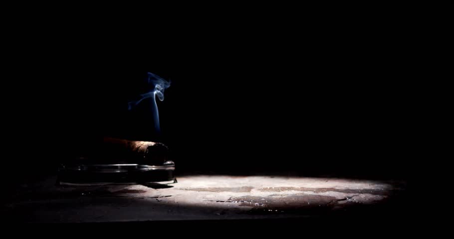 Glass of whiskey and smoking cigar on table. Slow motion, copy space, black background. Whiskey, brandy, cognac, alcoholic drink . Royalty-Free Stock Footage #3426658301