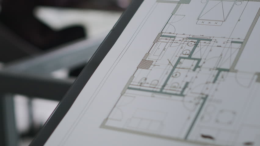 Architect working on building design with graphic software to create layout sketch for architecture project, drawing lines in small business office. Designer manufacturing scale. Handheld shot.