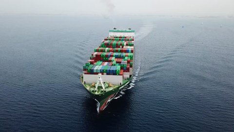 Aerial footage of a Mega Container ship sailing across The Mediterranean sea 스톡 비디오