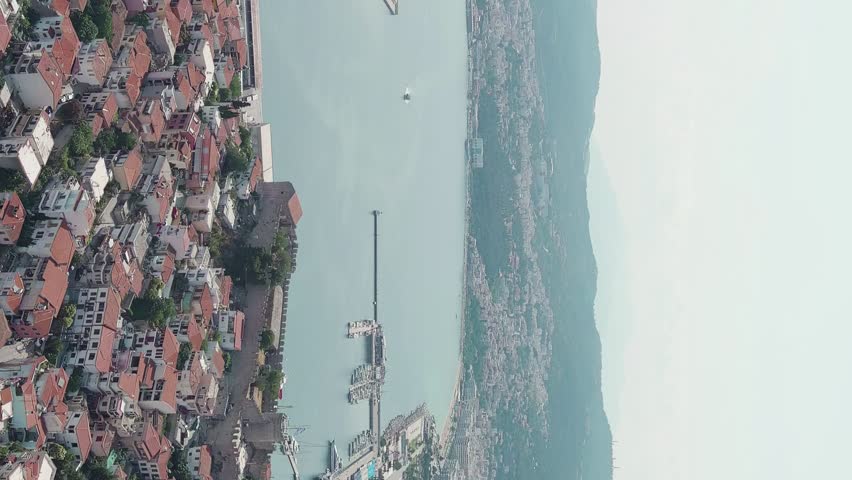 Vertical video. Kavala, Greece. Kavala Fortress. Historic city center. Aegean Sea. Summer, Aerial View