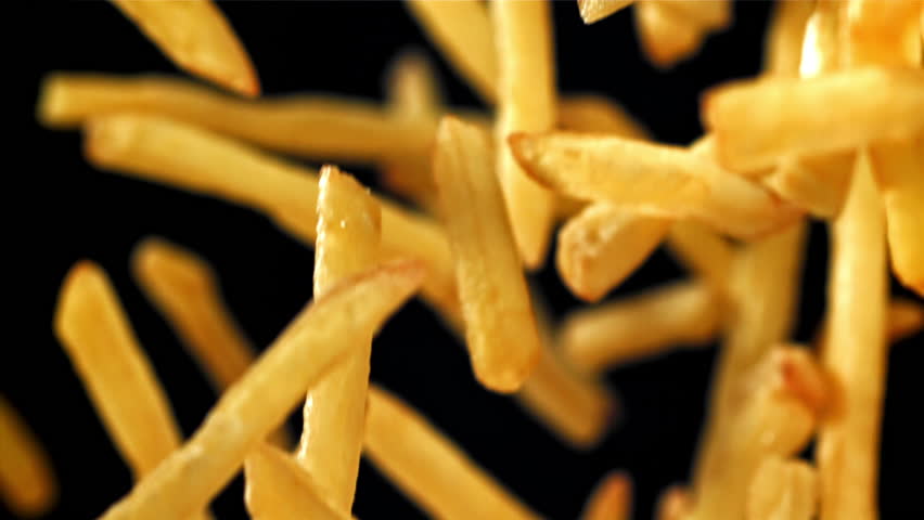 French fries fly up and fall down. Filmed on a high-speed camera at 1000 fps. High quality FullHD footage
