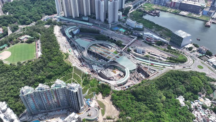 Drone Aerial Skyview in Tseung Kwan O Lam Tin Tunnel Interchange highway flyover ramp motorway road connects Kai Tak Development and Central Kowloon Route in Hong Kong Kwun Tong near Victoria Harbour Royalty-Free Stock Footage #3426886601