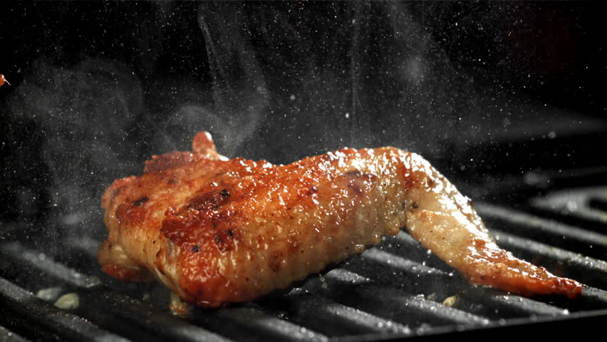 Chicken wing are fried in a pan. Filmed on a high-speed camera at 1000 fps. High quality FullHD footage