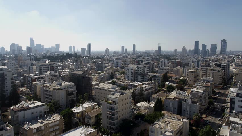 Aerial footage of the city of Ramat Gan, in the background the skyline of the city and the towers of the city of Tel Aviv.