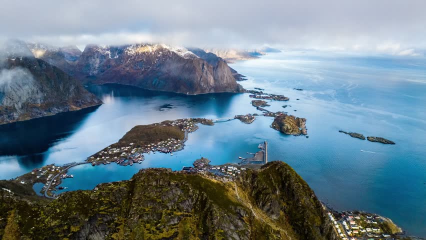 aerial hyperlapse time lapse in the fast moving clouds on reine fishing village on lofoten islands in norway