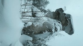 Stone Town in winter in the Perm region. Frozen snow-covered winter forest, deeply covered with snow in sunlight. Forest in the snow. Snowy winter. Trees in the snow in the Stone City. Russia. 4К