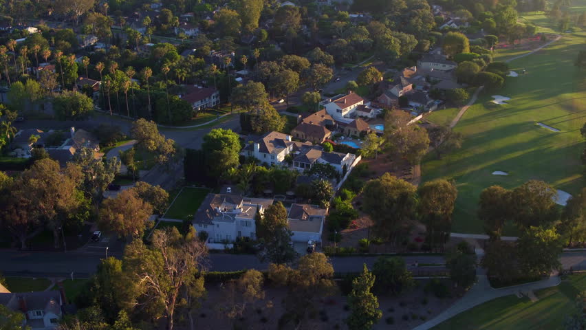 Aerial Panning Scenic View Of Houses And Golf Course On Sunny Day - Long Beach, California