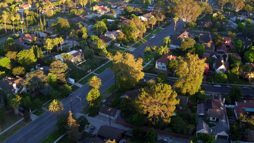 Aerial Panning Scenic Shot Of Residential Houses In City On Sunny Day - Long Beach, California