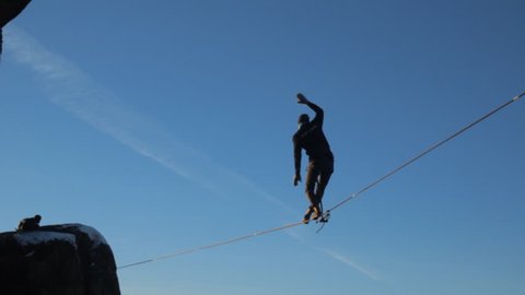 Ropewalker poised over the abyss