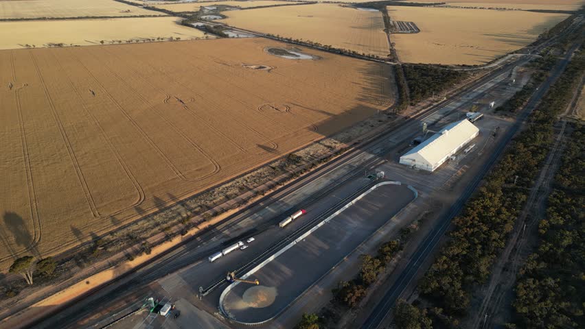 Aerial top down shot showing industrial distribution station on wheat field in Western Australia 