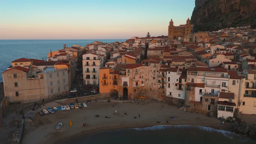 Cefalu during sunset. Sicily seaside town, Italy. Famous scenic tourism seafront