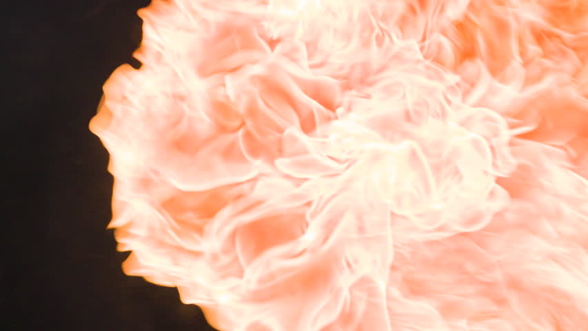 Flames in the Dark. Bright fiery flash in the air on a black background
