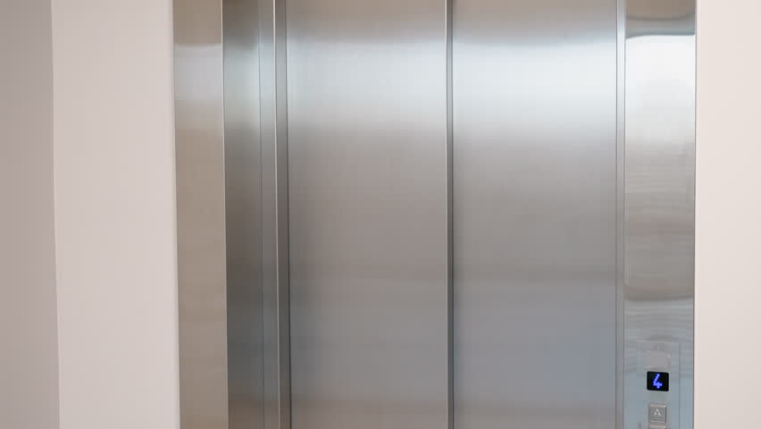 Dismissed african worker with dismissal box coming out of lift