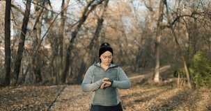 Woman Looking On Smart Watch Before Training Outdoor