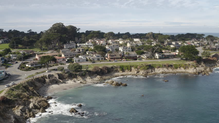 4K cinematic flight over ocean front houses in Pacific Grove California.