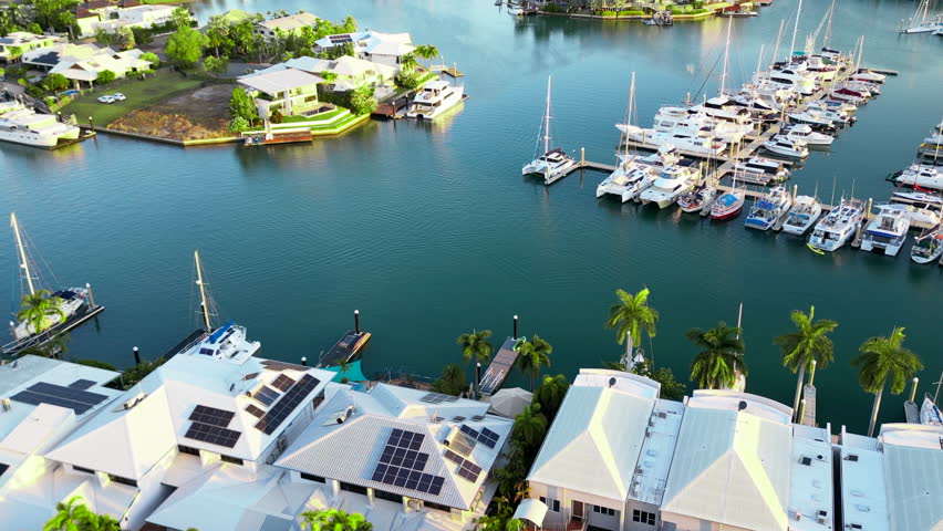 Aerial Drone Yachts in Boat Marina Cullen Bay Darwin Australia Surrounded By Luxury Real Estate House Homes and Greenery During Mid Afternoon Light