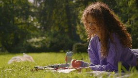Caucasian happy smiling young joyful woman female student relax read book while little funny dog corgi puppy roll on grass background meadow park nature girl reading literature outdoors summer weekend - Powered by Shutterstock - Get 15% off with code: PIKWIZARD15