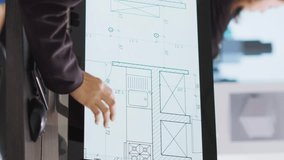 Vertical Video Technician operating on cad software to create blueprint for new architectural scaling project, using industrial elements in coworking space. Developer designing creative sketch - Powered by Shutterstock - Get 15% off with code: PIKWIZARD15