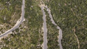 Top shot of driving car on the road in the Esporles valley on the island village of Mallorca in the Serra de Tramuntana, Spain