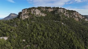 Drone shot of the forest hill in Esporles valley on the island village of Mallorca in the Serra de Tramuntana, Spain