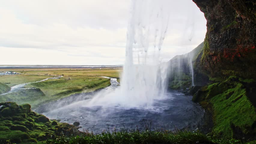 wide shot of Seljalandfoss one of the most beautiful waterfall in iceland in summer