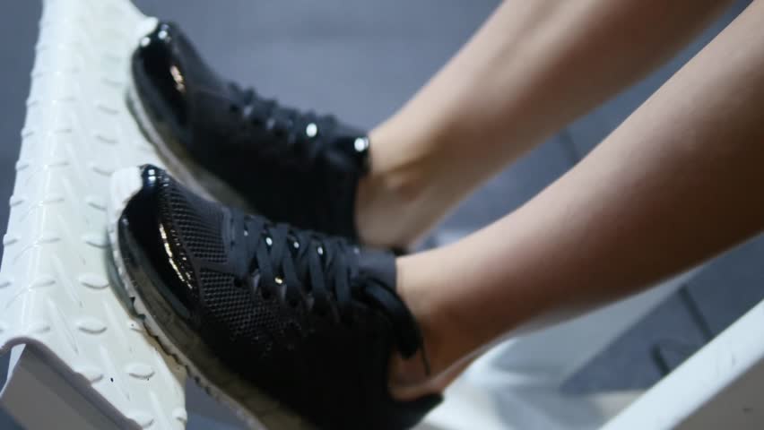 legs of a young woman who trains at the gym