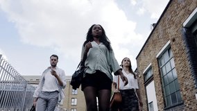 Group, people and walking city with confidence or teamwork as fashion designers for creative opportunity, pride or collaboration. Diversity, colleagues and stride downtown for commute, travel or trip - Powered by Shutterstock - Get 15% off with code: PIKWIZARD15