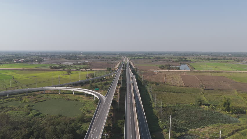 Drone shot scenic landscape Aerial view of rural highway traffic. Countryside road traffic with crossroad