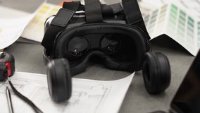 A young woman puts on a VR headset in her office and works on a project in a virtual space. Slow motion. - Powered by Shutterstock - Get 15% off with code: PIKWIZARD15