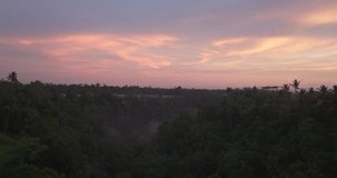 Indonesian jungle at sunset, Bali in Indonesia. Aerial view and colorful sky for copy space