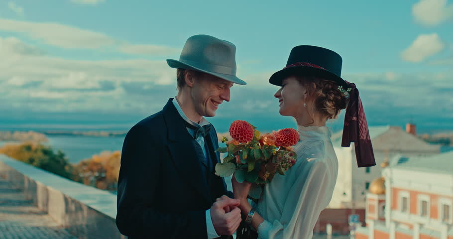 medium portrait of happy loving couple in 19th century style in beautiful city, 4K, Prores