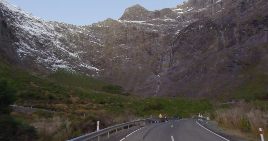Driving On State Highway 94 Near Homer Tunnel Towards Milford Sound Fiordland National Park In South Island, New Zealand. POV Royalty-Free Stock Footage #3427887955