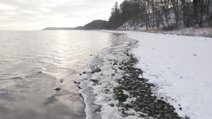 Snow-Covered Seashore During Winter. Aerial Drone Shot