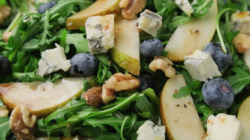 Pear Gorgonzola cheese, blueberries and Walnut Salad. Healthy food Royalty-Free Stock Footage #3427931423