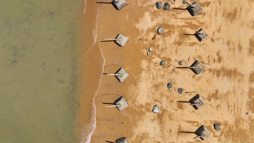 Aerial top down shot of anti Landing barrier at sandy beach of Kinmen, 金門, Quemoy Island, Taiwan